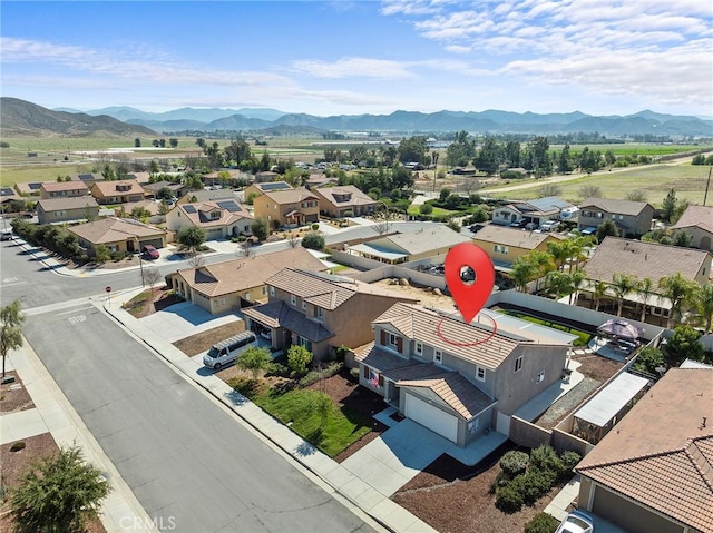 drone / aerial view with a residential view and a mountain view