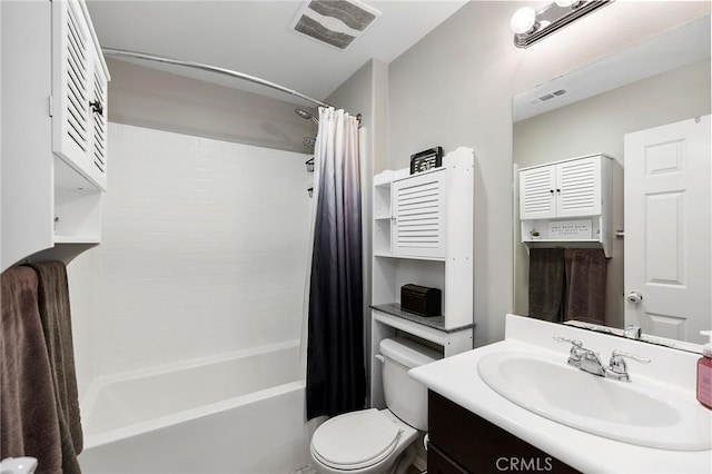 bathroom with toilet, shower / tub combo, visible vents, and vanity