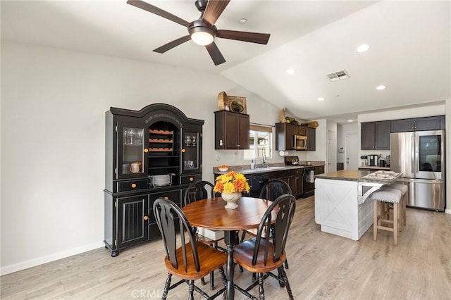 dining area featuring recessed lighting, visible vents, baseboards, vaulted ceiling, and light wood-type flooring