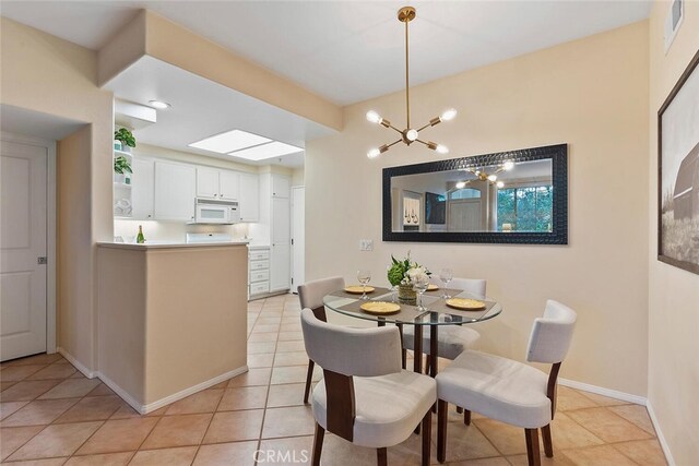 1703 Solvay Aisle Unit 106, Irvine, CA 92606 - dining area with light tile patterned floors and a chandelier