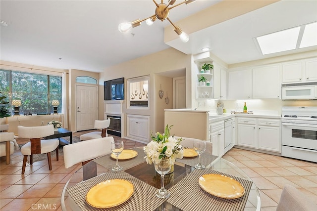 1703 Solvay Aisle Unit 106, Irvine, CA 92606 - dining room featuring light tile patterned floors and a skylight