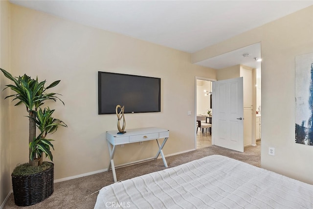 carpeted bedroom with baseboards