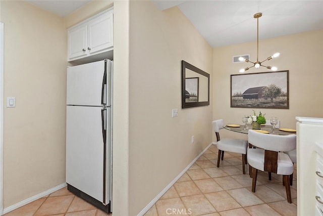 1703 Solvay Aisle Unit 106, Irvine, CA 92606 - dining room featuring light tile patterned flooring and a chandelier