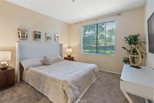 carpeted bedroom with baseboards