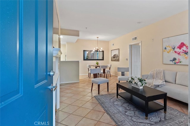 1703 Solvay Aisle Unit 106, Irvine, CA 92606 - living room featuring light tile patterned floors and a chandelier