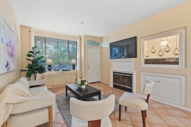 1703 Solvay Aisle Unit 106, Irvine, CA 92606 - living area with light tile patterned floors and a glass covered fireplace