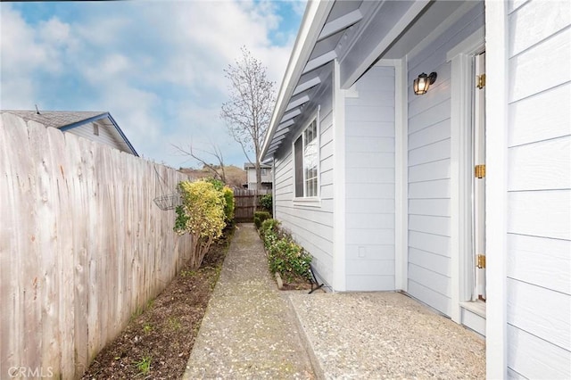 view of home's exterior featuring fence