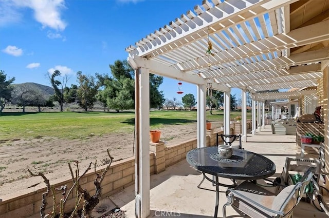 view of patio / terrace with a mountain view and a pergola