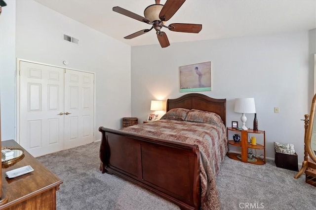 bedroom featuring light carpet, ceiling fan, and visible vents