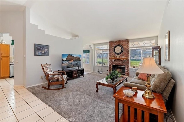 living area featuring light carpet, light tile patterned floors, and a brick fireplace