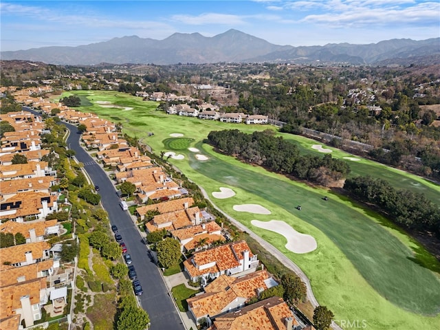 birds eye view of property with a residential view, view of golf course, and a mountain view