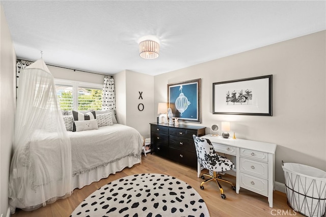 bedroom featuring light wood-style floors