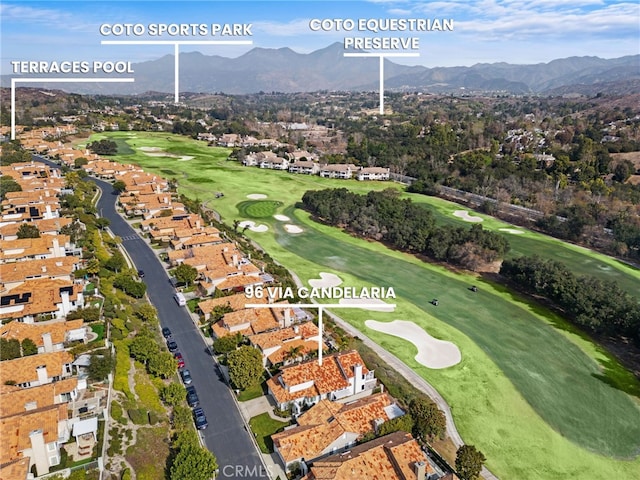 bird's eye view featuring a residential view, view of golf course, and a mountain view