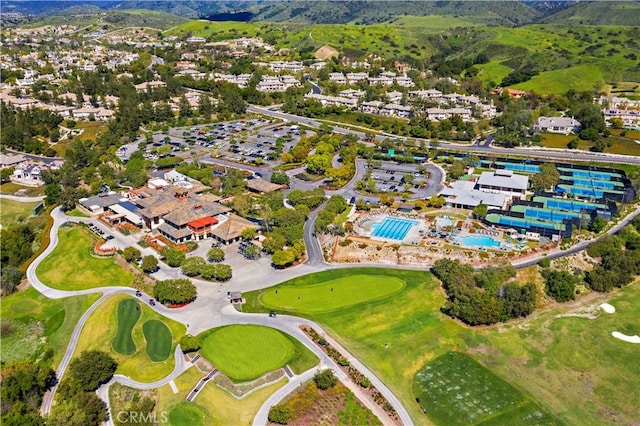 birds eye view of property with view of golf course