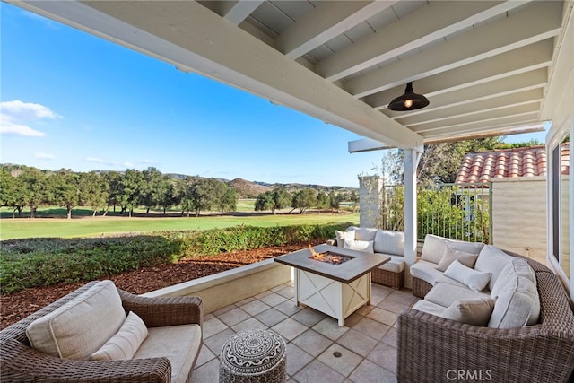 view of patio featuring an outdoor living space with a fire pit