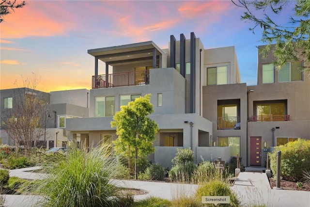 contemporary house with stucco siding