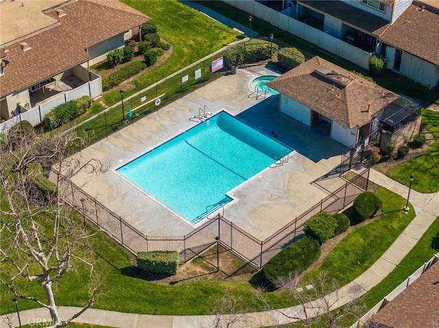 pool featuring a patio and fence