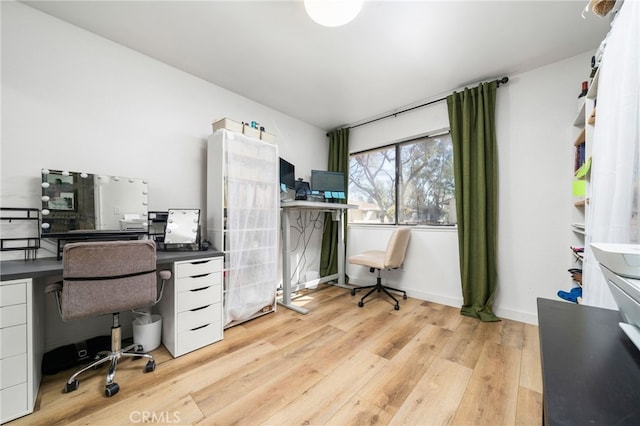 office featuring light wood-style floors and baseboards