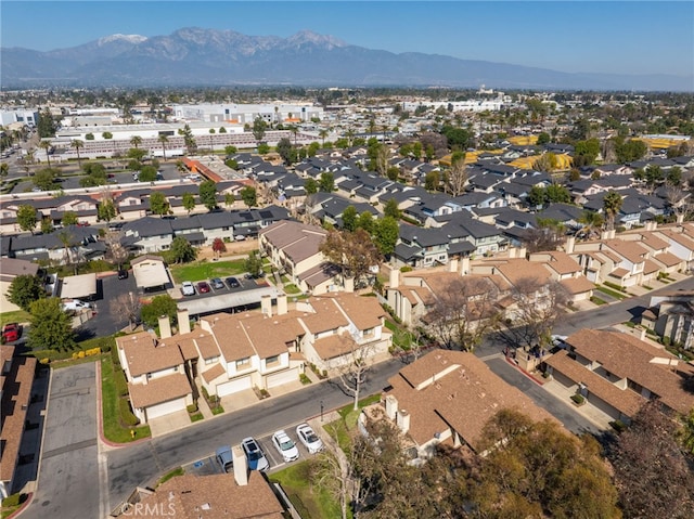 drone / aerial view featuring a residential view and a mountain view