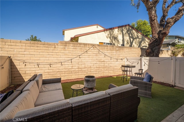 view of patio / terrace with a fenced backyard and an outdoor living space