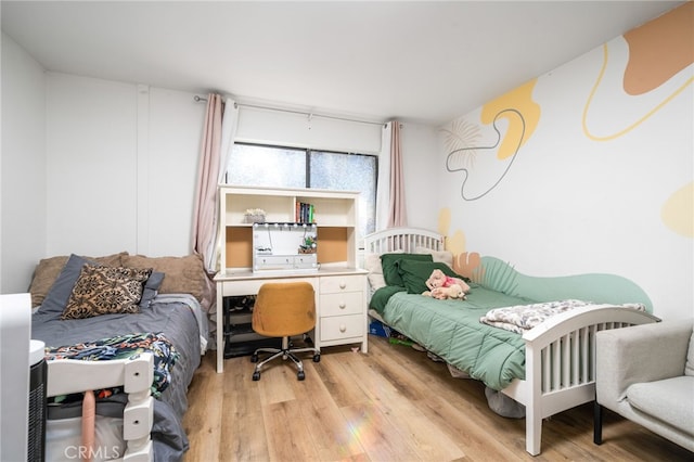 bedroom with light wood-style flooring