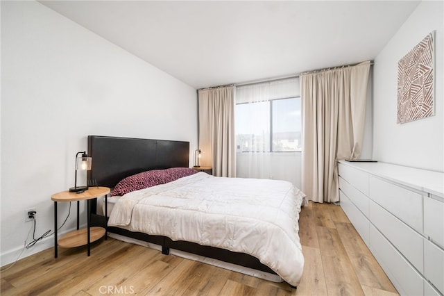 bedroom with light wood-style floors