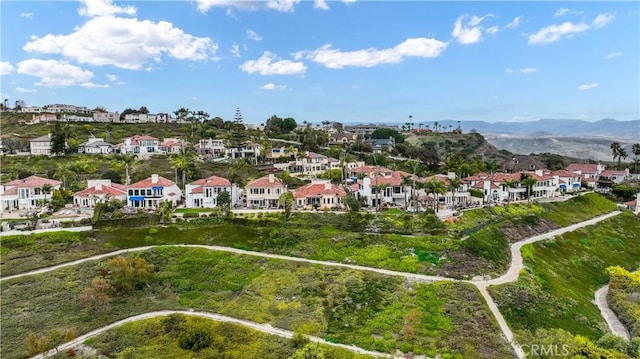 bird's eye view with a residential view and a mountain view