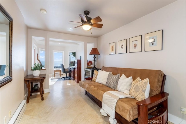 living area featuring ceiling fan, baseboards, and baseboard heating