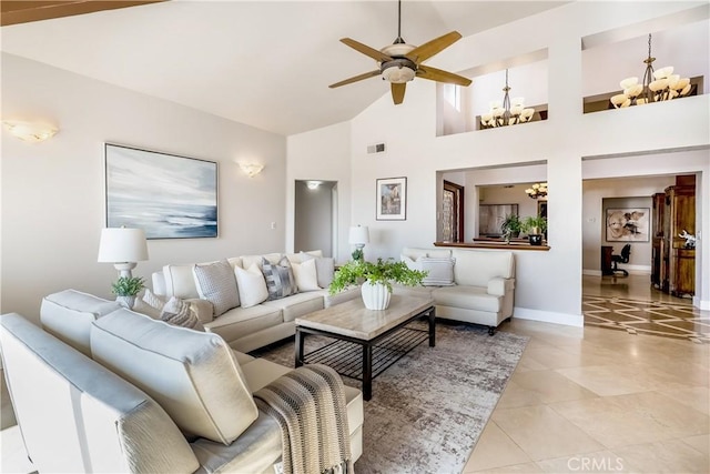 living area featuring visible vents, light tile patterned flooring, high vaulted ceiling, baseboards, and ceiling fan with notable chandelier