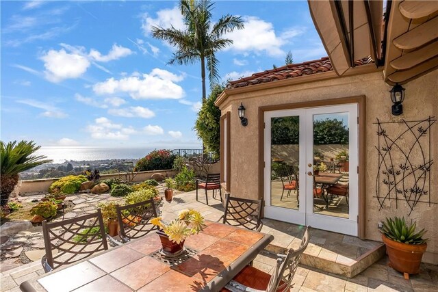 view of patio / terrace with french doors and outdoor dining space