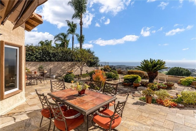 view of patio / terrace with outdoor dining area and fence