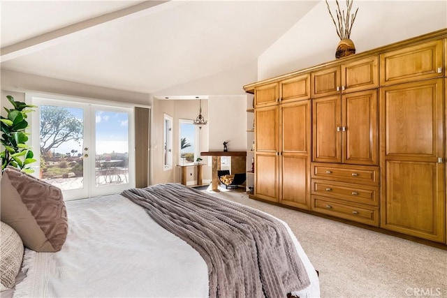 bedroom featuring lofted ceiling, access to outside, and light colored carpet