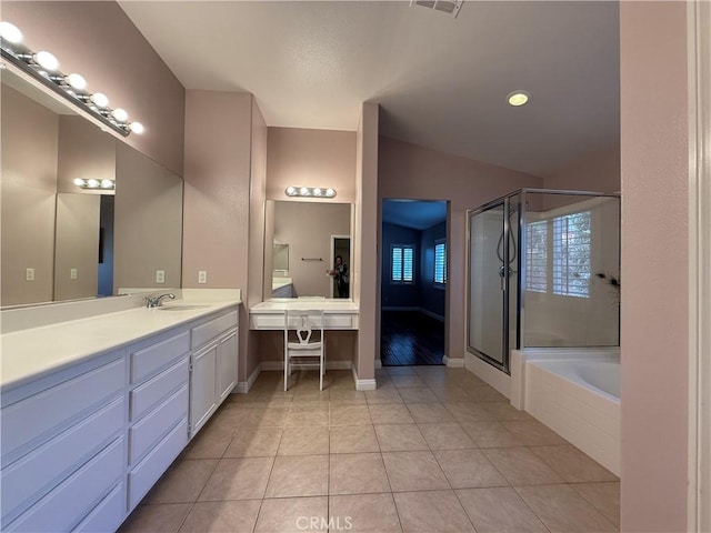 full bathroom featuring tile patterned flooring, a shower stall, vanity, and a bath