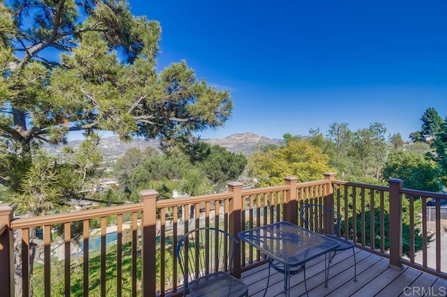 wooden terrace featuring a mountain view