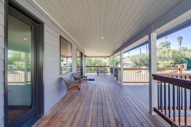 wooden terrace featuring a porch