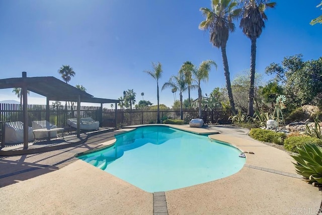 view of pool with fence, a fenced in pool, and a patio