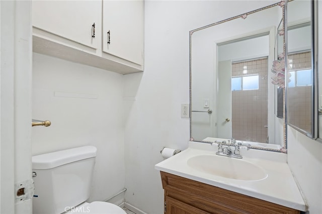 full bath with toilet, a shower, and vanity