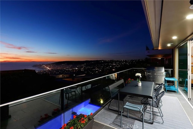 view of balcony at dusk