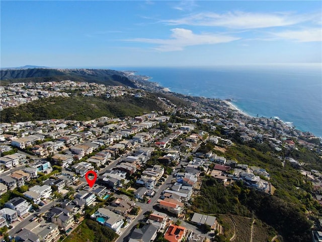 drone / aerial view featuring a water view and a residential view