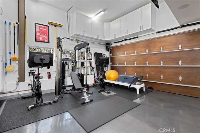 exercise room featuring a garage