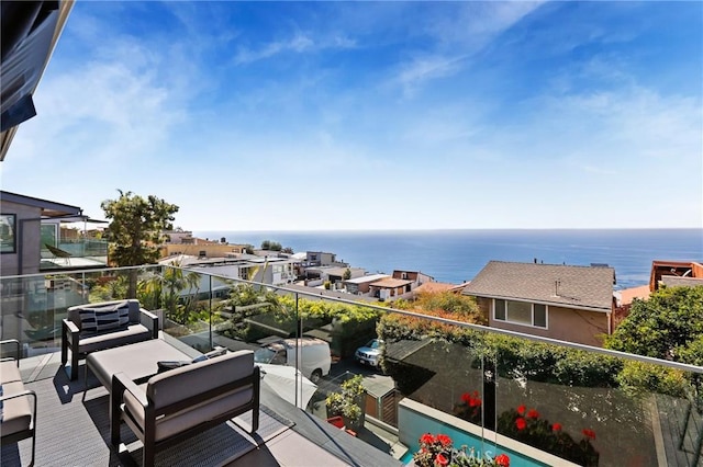 balcony featuring a water view