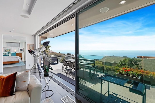 balcony with a water view and visible vents