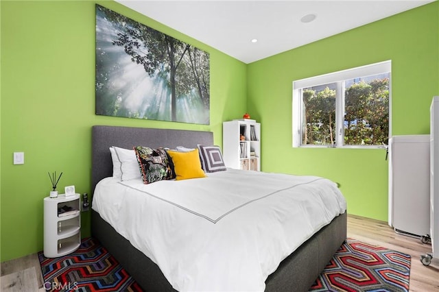 bedroom featuring recessed lighting and light wood-style floors