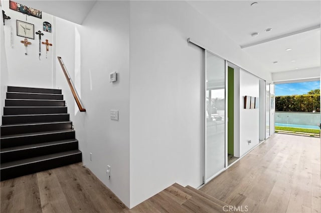 interior space with stairway and wood finished floors