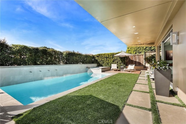 view of pool with a yard, a patio, a fenced backyard, and a fenced in pool