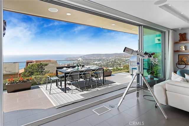 balcony with a water view and visible vents