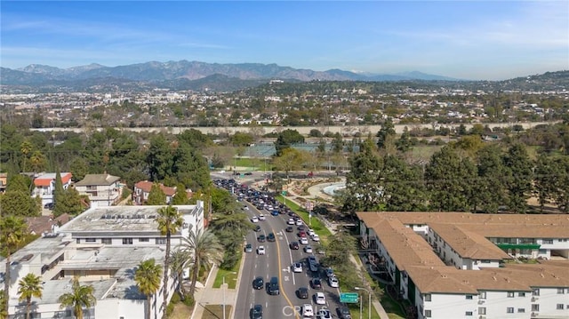 drone / aerial view featuring a residential view and a mountain view