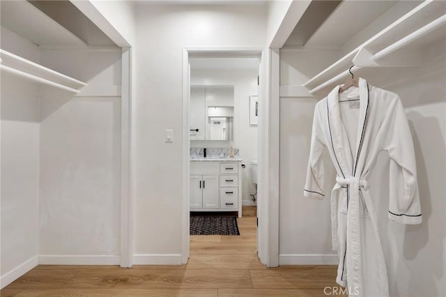 spacious closet with light wood-type flooring