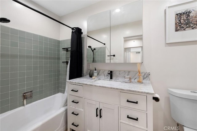 bathroom featuring toilet, vanity, and shower / bathtub combination with curtain