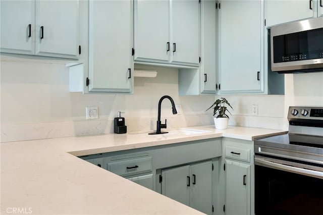 kitchen featuring stainless steel appliances and a sink